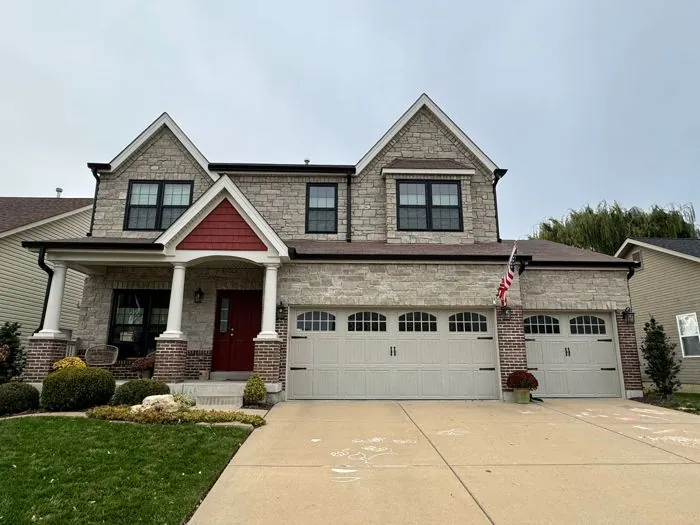 St. Louis area home with seamless gutters and downspouts