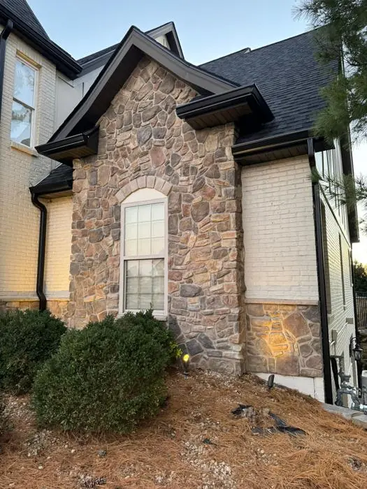 St. Louis area home with seamless gutters and downspouts