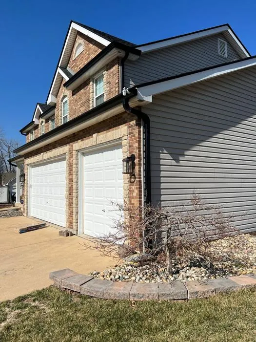 St. Louis area home with seamless gutters and downspouts