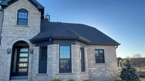 St. Louis area home with seamless gutters and downspouts