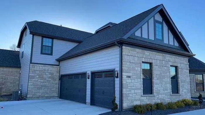 St. Louis area home with seamless gutters and downspouts